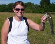 Pictured is Mrs. McVey after she landed a 10 pound bass. (At least - that is what she told everyone it weighed)