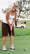 Mrs. McVey enjoying one of her favorite hobbies - golfing.