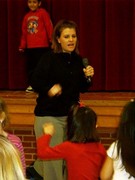 Mrs. McVey teaching the elementary students dance class on Friday mornings.