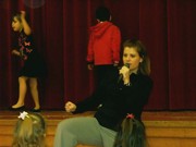 Mrs. McVey teaching the elementary students dance class on Friday mornings.